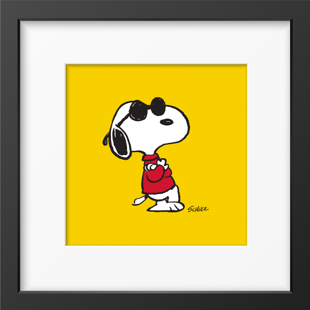 Snoopy as Joe Cool with black sunglasses and a red shirt against a yellow background, framed Peanuts print