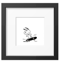 Snoopy riding a black skateboard with a grin, framed black and white Peanuts print in a black frame